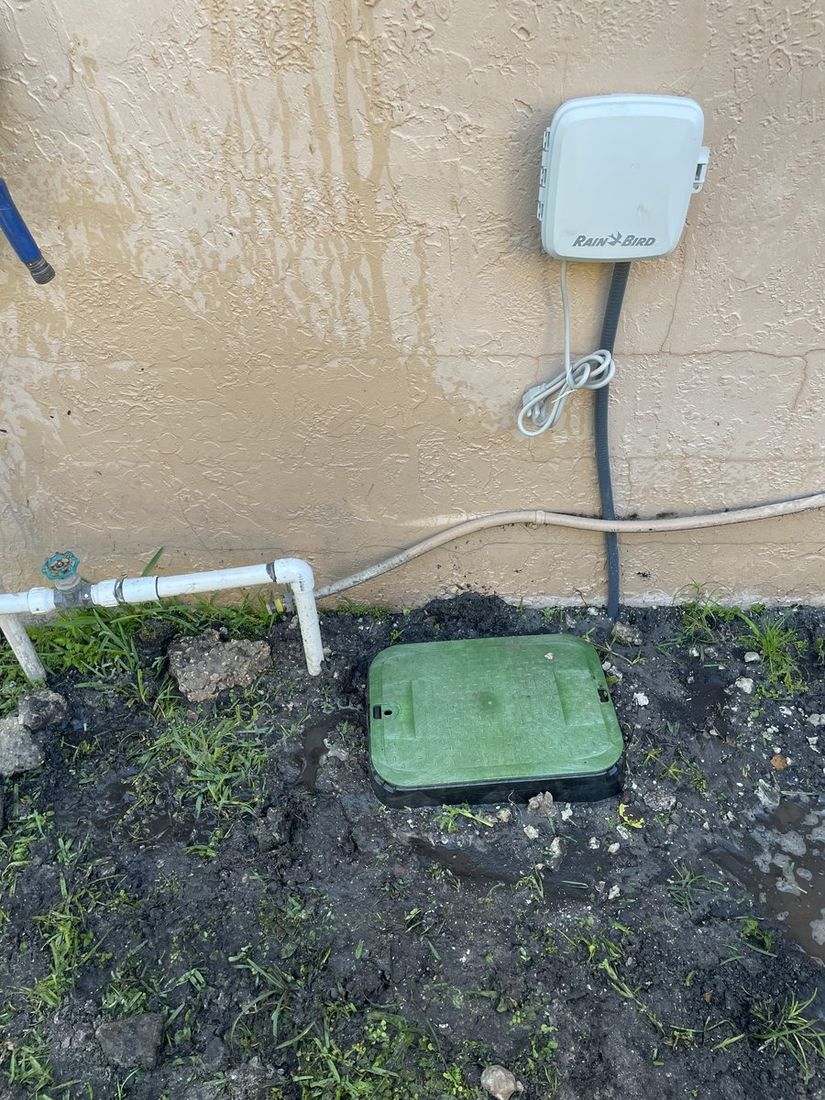 Before: outdated irrigation system with manual valves and basic Rain Bird controller in Coconut Creek, FL — no WiFi, no remote access
